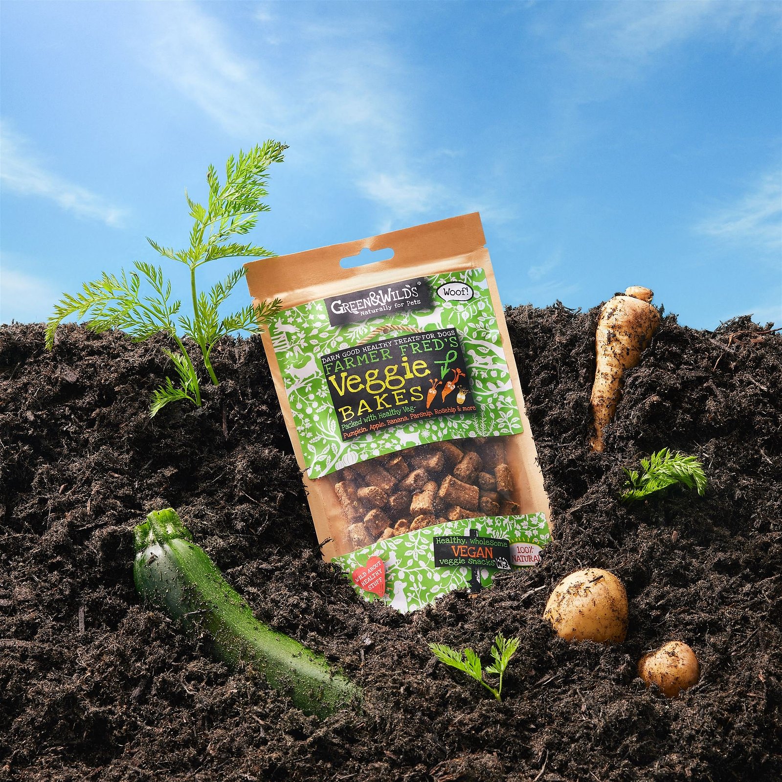 Creative pet food product photography – studio Creative studio product photography of pet food packaging styled in soil with vegetables for a commercial pet food brand campaign for Green & Wilds