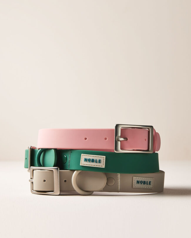 Studio product photography of stacked dog collars for a commercial pet accessories brand noble
