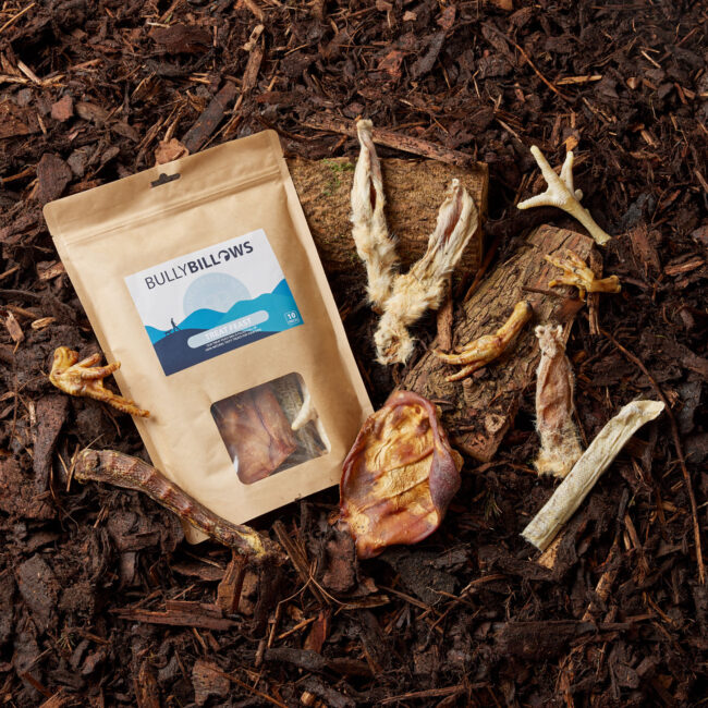 Studio flat lay product photography of pet treats with natural ingredients for a commercial pet food campaign Bully Billows